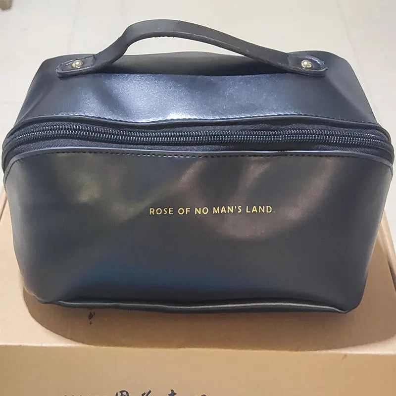 a blue bag sitting on top of a cardboard box