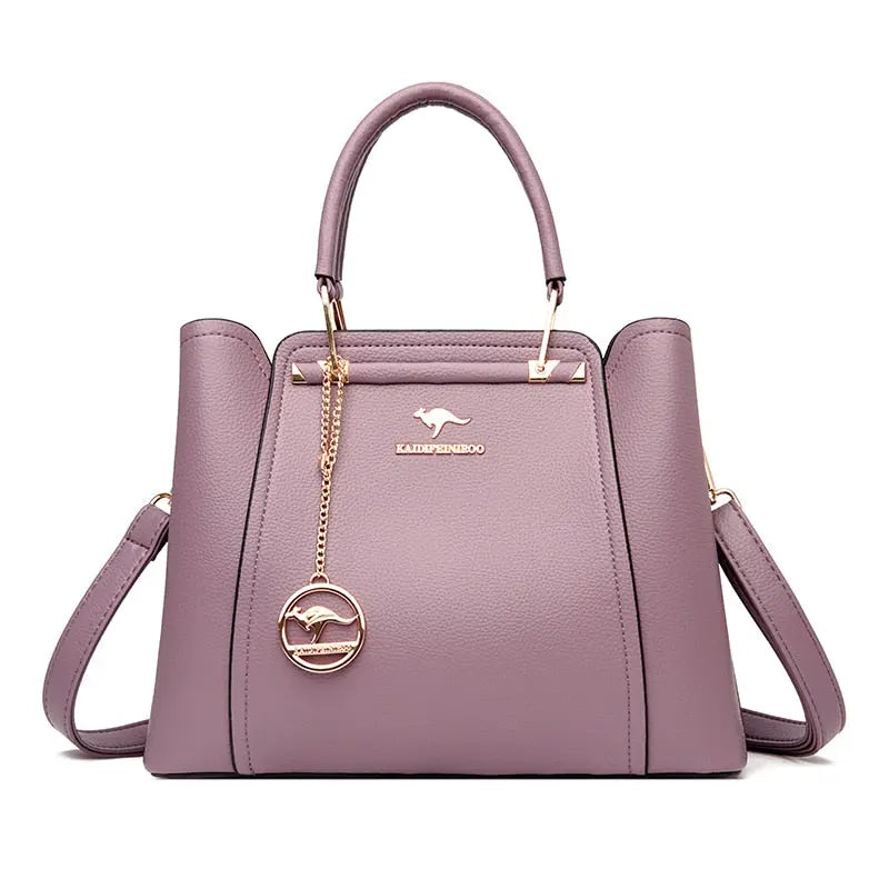 a purple handbag with a gold handle