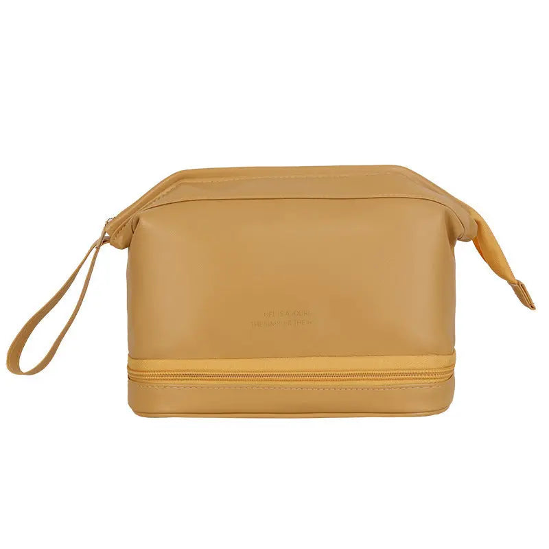 a tan leather toiletry bag on a white background