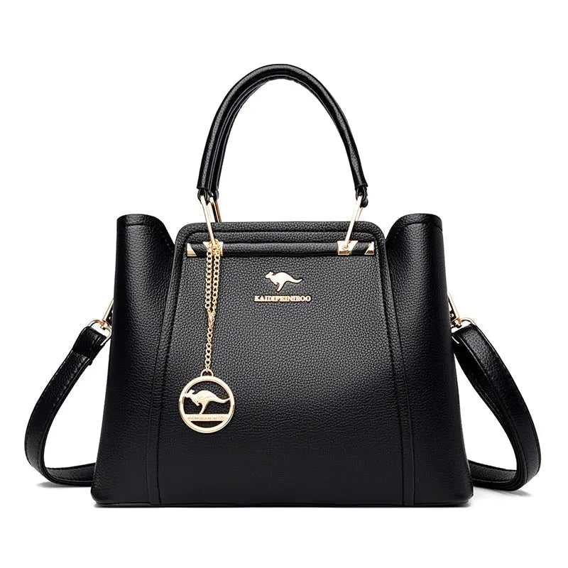 a black handbag with a gold handle